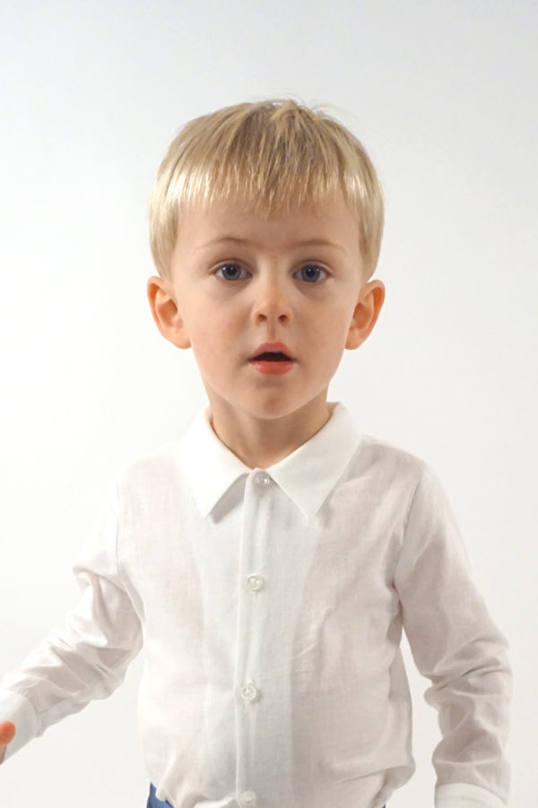 A boy wearing a plain white cotton shirt - The Little Wedding Company