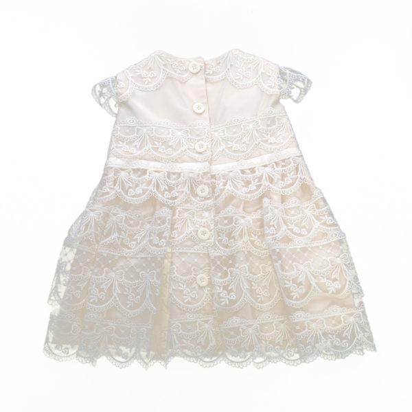 A christening dress with lace tiers and button back - The Little Wedding Company