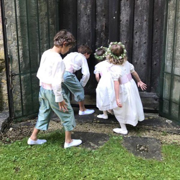 Two pageboys and two bridesmaids with eau el taffeta shorts and white cotton shirts - The Little Wedding Company