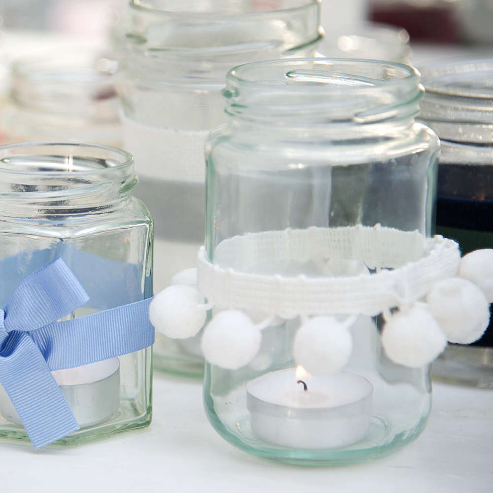 Picture of jam jars with pompom trim - The Little Wedding Company