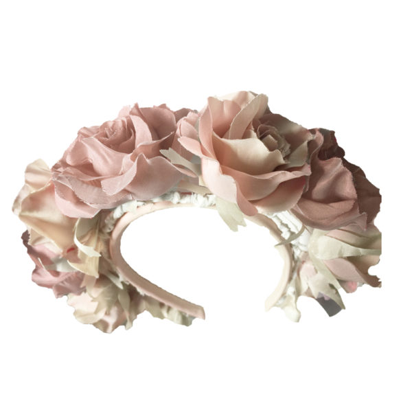 A pale pink hairband with silk roses all around it - The Little Wedding Company