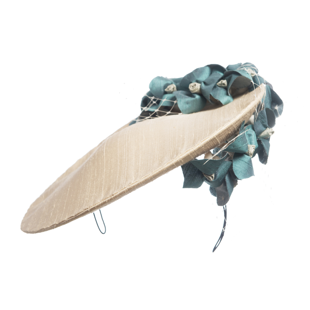 Ivory assymetric taffeta hat on a hairband with aqua forget-me-not flowers and ivory net - The Little Wedding Company