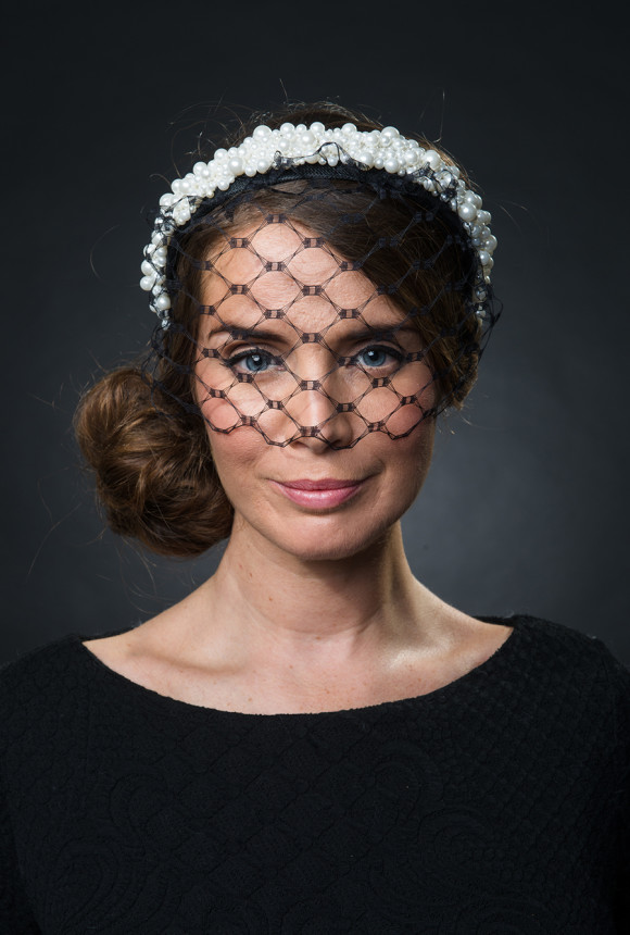 Picture of a woman wearing a pearl hairband with a black veil - The Little Wedding Company