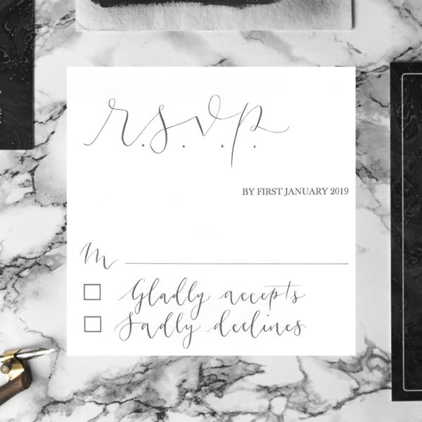 A white RSVP card with grey handwritten calligraphy - The Little Wedding Company